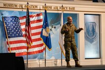 Man in uniform speaking on stage