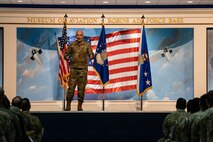 Man in uniform speaking on stage
