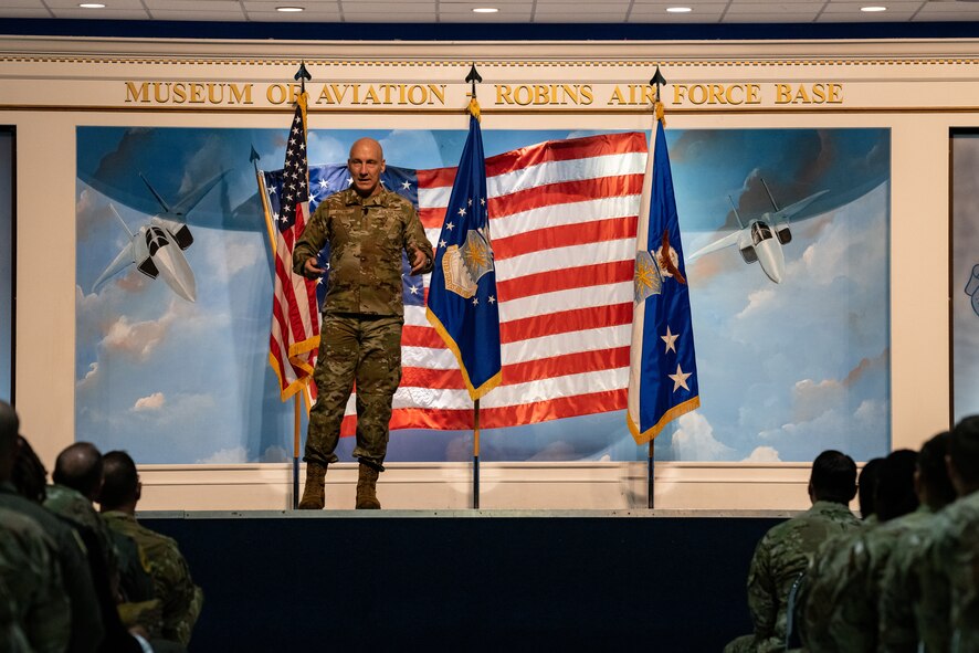 Man in uniform speaking on stage