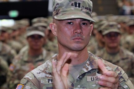 Capt. Justin Phelps, 41st Infantry Brigade Headquarters and Headquarters Company commander, leads his company formation at the Oregon Army National Guard’s 41st Infantry Brigade Combat Team mobilization ceremony at the Salem Armory Auditorium in Salem, Ore., Aug. 16. The event marked the beginning of a significant deployment as the unit prepares to join the NATO-led Kosovo Force for a year-long mission