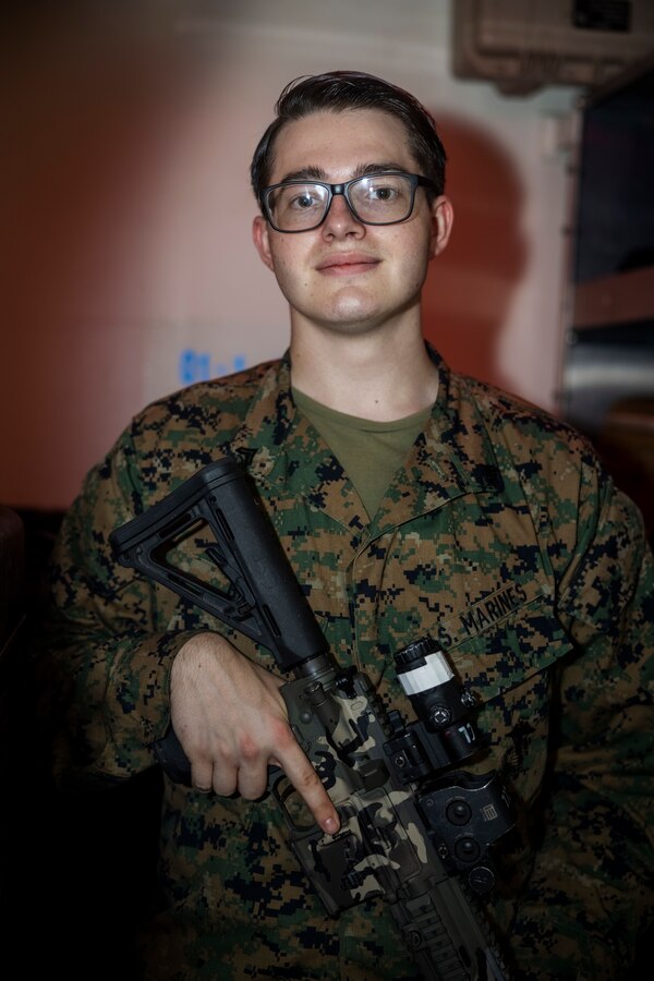 U.S. Marine Corps Cpl. Devin Blair, an Austin, Texas native and armory chief with Maritime Special Purpose Force, 24th Marine Expeditionary Unit (MEU) Special Operations Capable (SOC), poses for a photo while holding an M27 Reconnaissance Weapons Kit aboard the amphibious assault ship USS Wasp (LHD 1) while underway in the Mediterranean Sea, Aug. 16, 2024. The Wasp (WSP) Amphibious Ready Group (ARG) and embarked 24th MEU (SOC) is conducting operations in the U.S. Naval Forces Europe and Africa (NAVEUR-NAVAF) area of operations on a scheduled deployment. The WSP ARG-24th MEU (SOC) is supporting U.S., Allied and partner interests in the region, including in the Eastern Mediterranean Sea, to continue promoting regional stability and deterring aggression. (U.S. Marine Corps photo by Lance Cpl. John Allen)