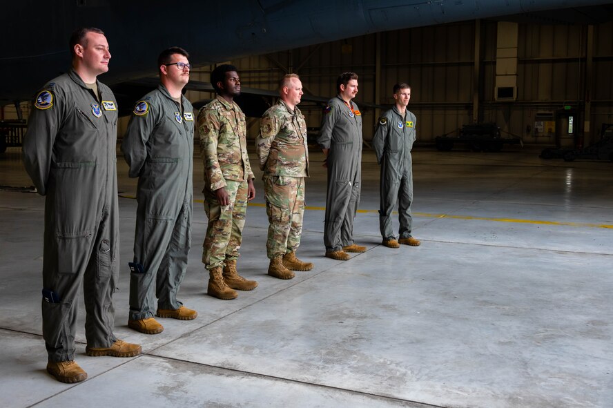 Airmen from the 5th Bomb Wing wait to greet North Dakota Lt. Gov. Tammy Miller at Minot Air Force Base, North Dakota, Aug. 15, 2024. Miller received a tour of a B-52H Stratofortress to familiarize her with Minot AFB’s mission. (U.S. Air Force photo by Senior Airmen Alexander Nottingham)