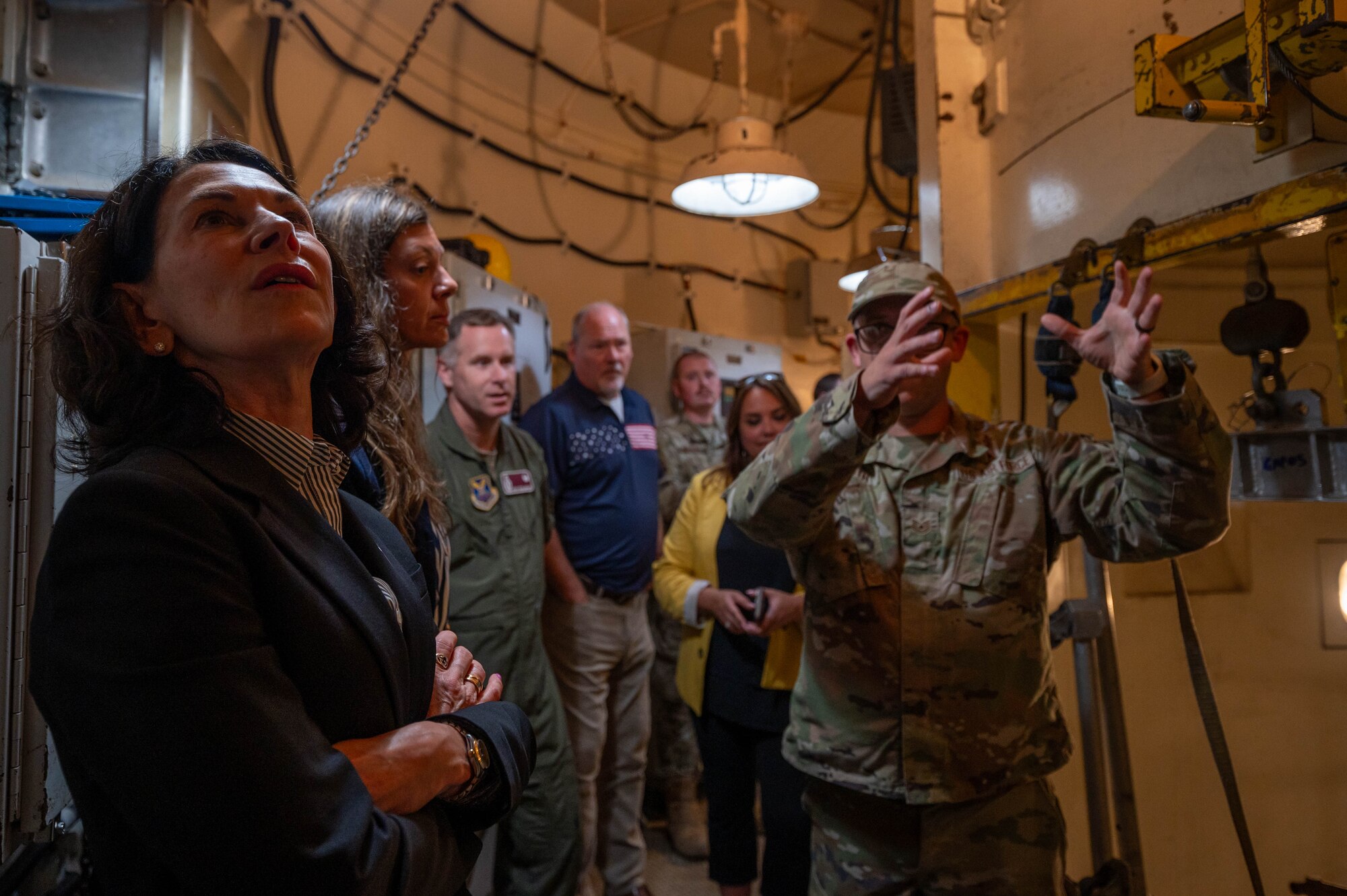An instructor from the 373rd Training Squadron, Detachment 23 provides a tour of a simulated launch facility to North Dakota Lt. Gov. Tammy Miller and other local leaders at Minot Air Force Base, North Dakota, Aug. 15, 2024. Miller and local leaders learned the importance of the 91st Missile Wing mission as one of the Air Force's three intercontinental ballistic missile wings. (U.S. Air Force photo by Senior Airmen Alexander Nottingham)