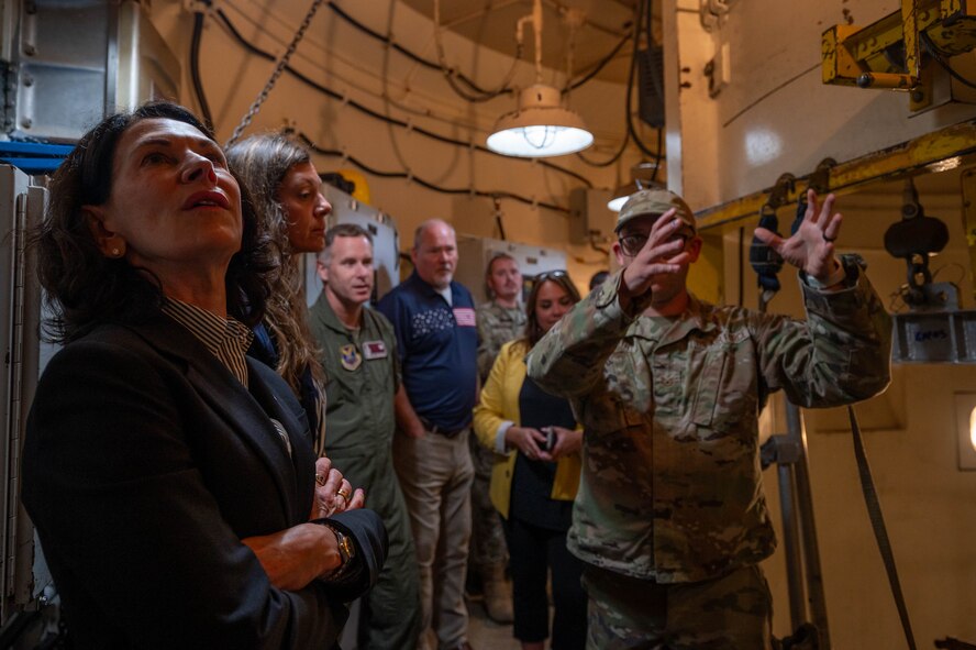 An instructor from the 373rd Training Squadron, Detachment 23 provides a tour of a simulated launch facility to North Dakota Lt. Gov. Tammy Miller and other local leaders at Minot Air Force Base, North Dakota, Aug. 15, 2024. Miller and local leaders learned the importance of the 91st Missile Wing mission as one of the Air Force's three intercontinental ballistic missile wings. (U.S. Air Force photo by Senior Airmen Alexander Nottingham)