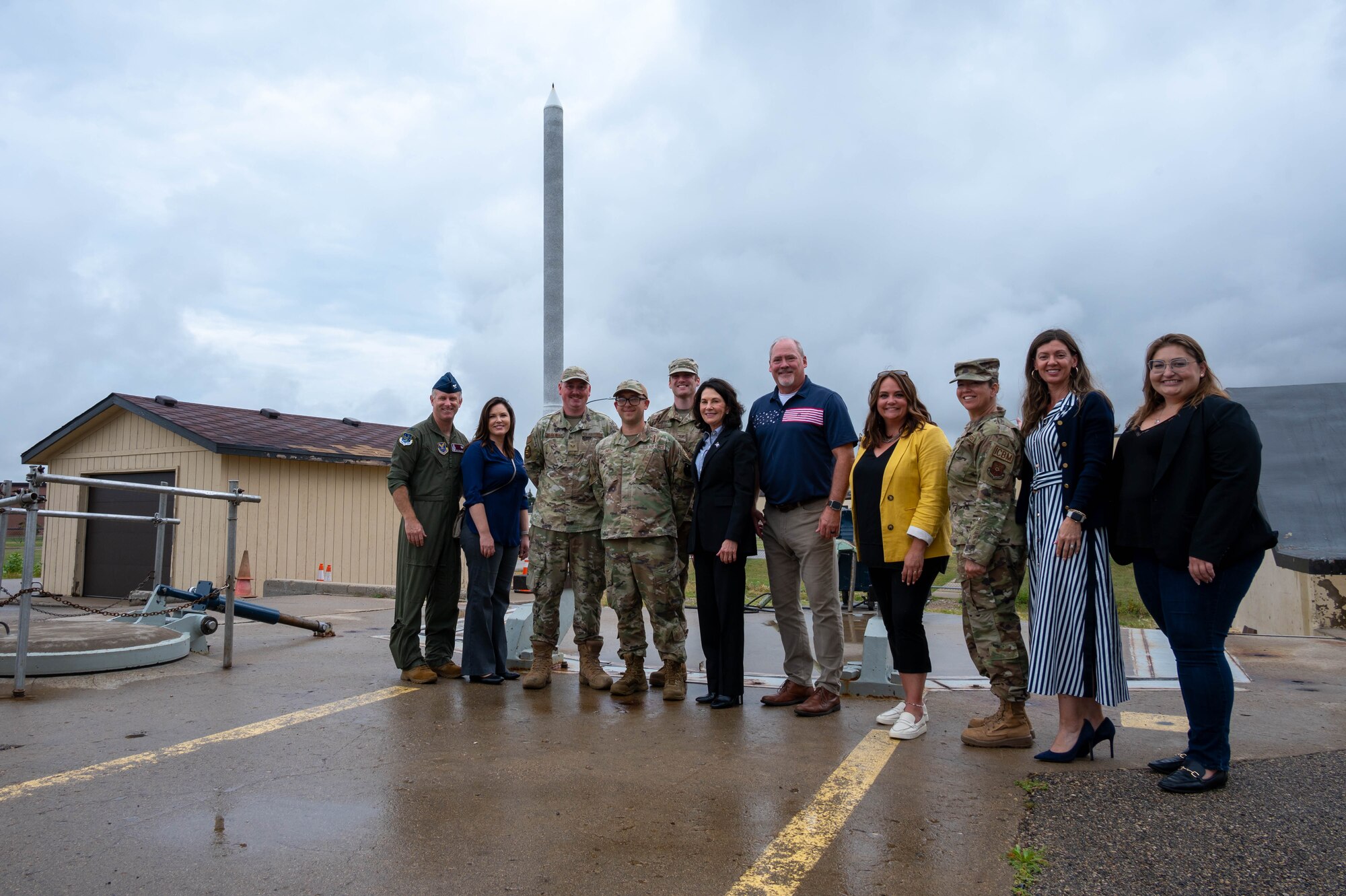 Team Minot Airmen, leaders and distinguished visitors pose for a group photo in front of a B-52H Stratofortress at Minot Air Force Base, North Dakota, Aug. 15, 2024. Miller and local leaders learned the importance of the 91st  Missile Wing mission as one of the Air Force's three intercontinental ballistic missile wings. (U.S. Air Force photo by Senior Airmen Alexander Nottingham)