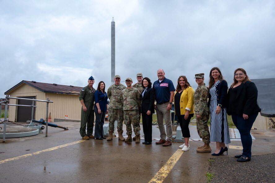 Team Minot Airmen, leaders and distinguished visitors pose for a group photo in front of a B-52H Stratofortress at Minot Air Force Base, North Dakota, Aug. 15, 2024. Miller and local leaders learned the importance of the 91st  Missile Wing mission as one of the Air Force's three intercontinental ballistic missile wings. (U.S. Air Force photo by Senior Airmen Alexander Nottingham)