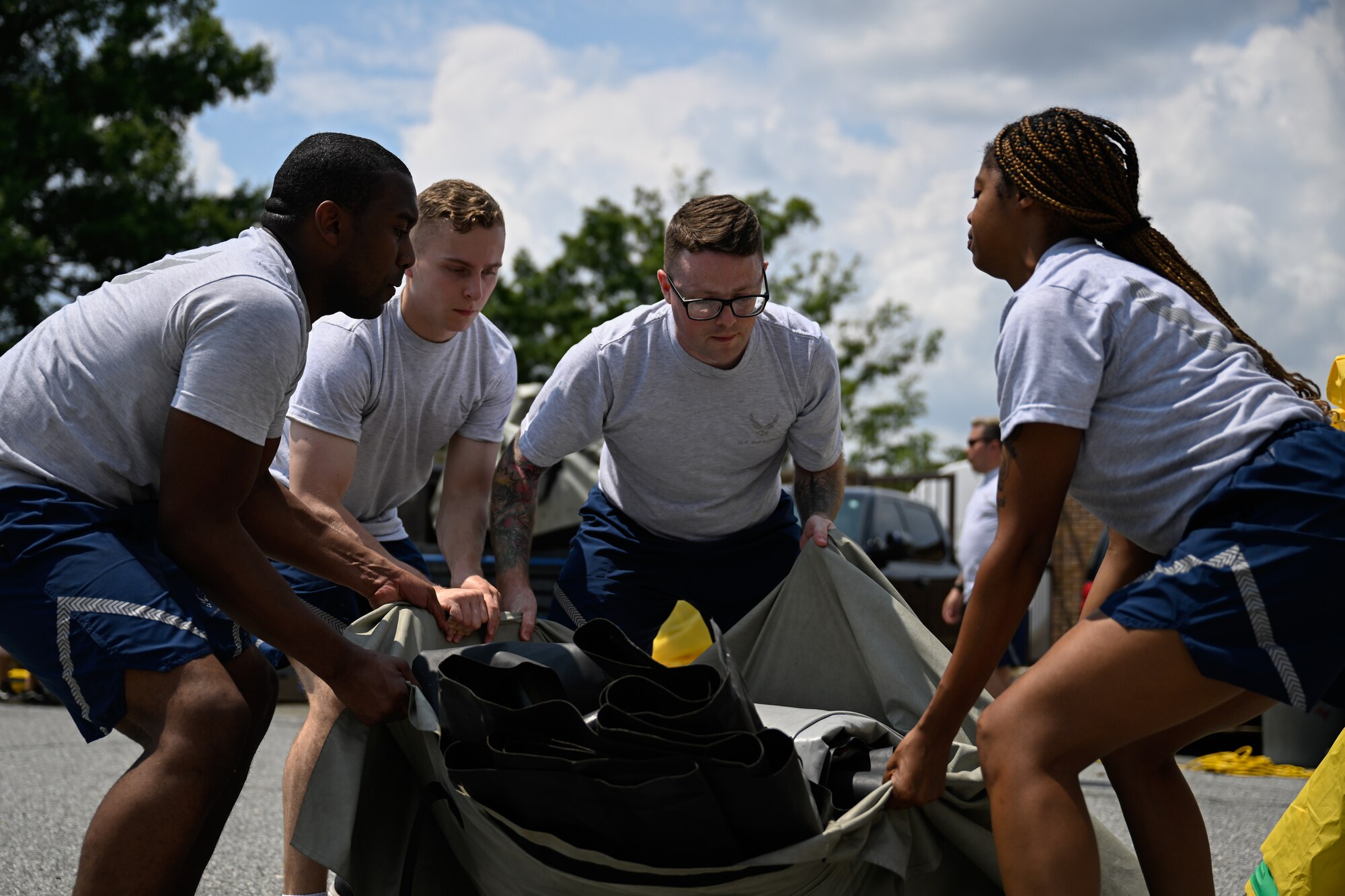 Airmen set up a decontamination center while participating in a decontamination exercise.