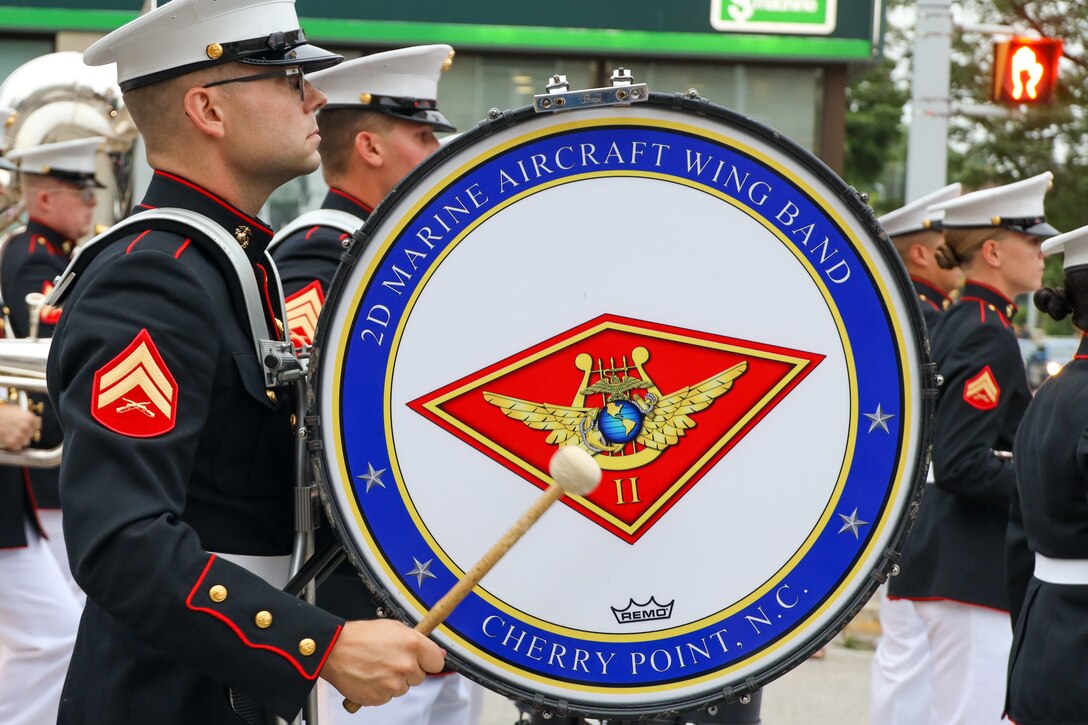 U.S. Marines with the 2nd Marine Aircraft Wing (MAW) Band march during the opening parade of the Fergus Scottish Festival & Highland Games in Ontario, Canada, Aug. 8, 2024. The Fergus Scottish Festival & Highland Games is an annual three-day event celebrating local Scottish heritage through various forms of entertainment. The 2nd MAW Band will be performing during the festival to strengthen community relationships and reaffirm the history, customs, and traditions represented by the United States Marine Corps. (U.S. Marine Corps photo by Staff. Sgt. Theodore Bergan)