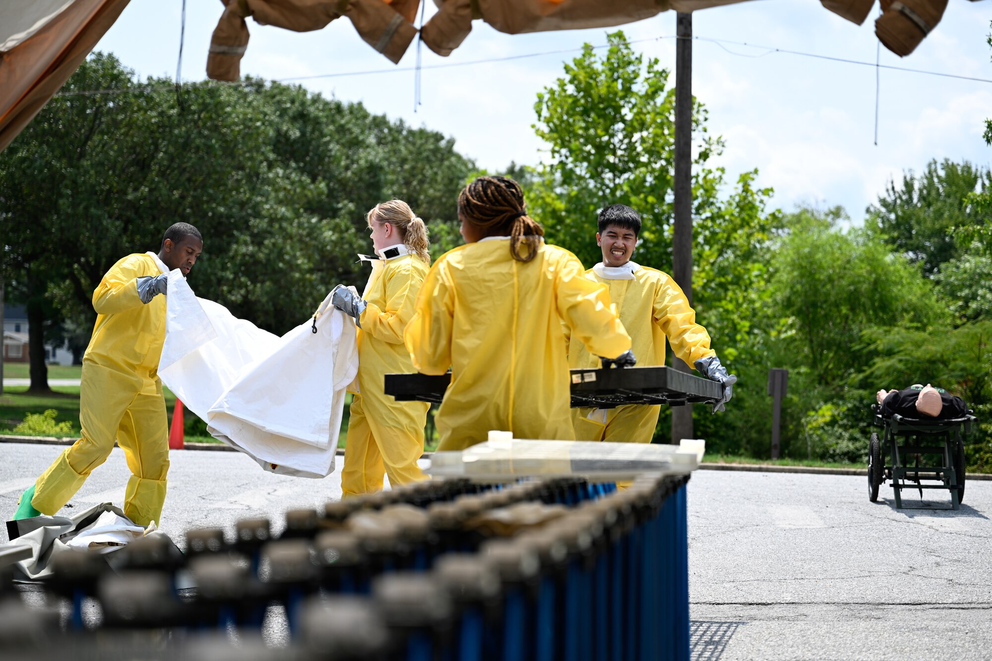 Airmen assemble a decontamination tent for a decontamination exercise.