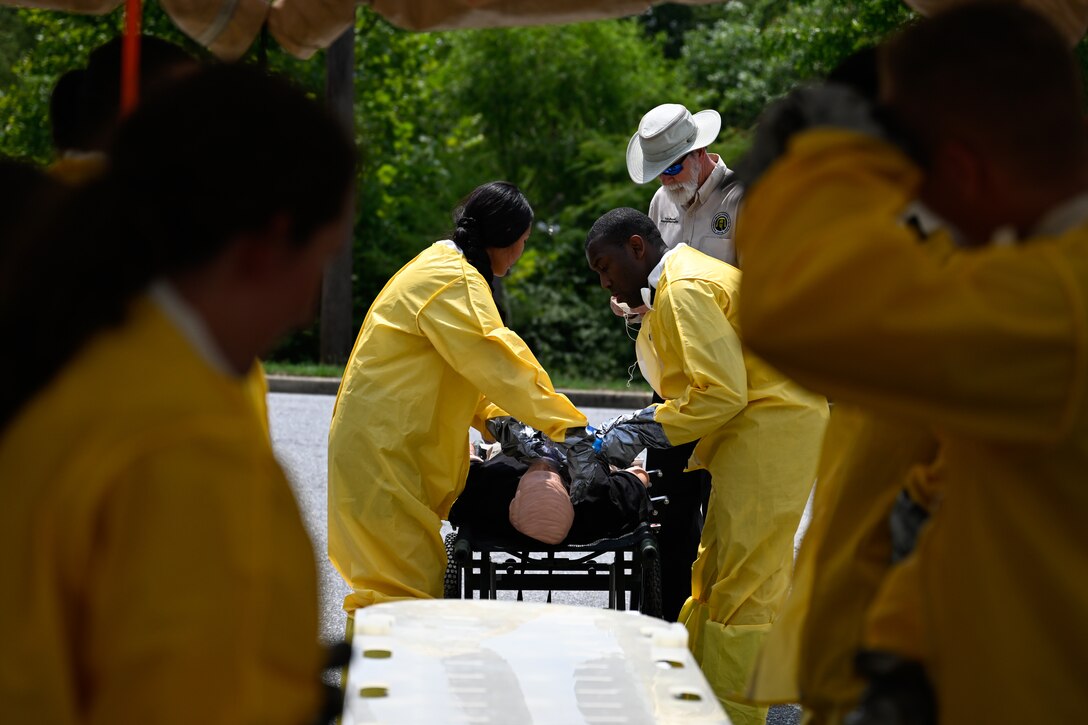 Airmen prepare a mannequin for the decontamination exercise.