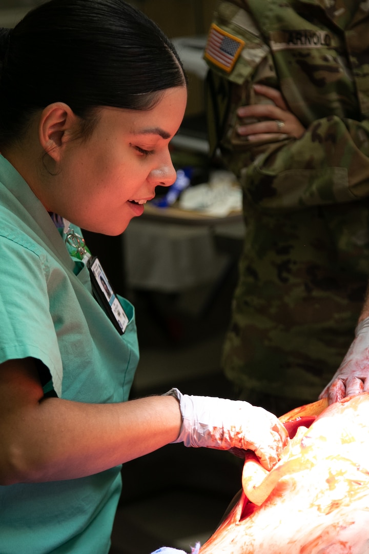 Surgical Technician at Weed Army Community Hospital Inspects Realistic Training Apparatus