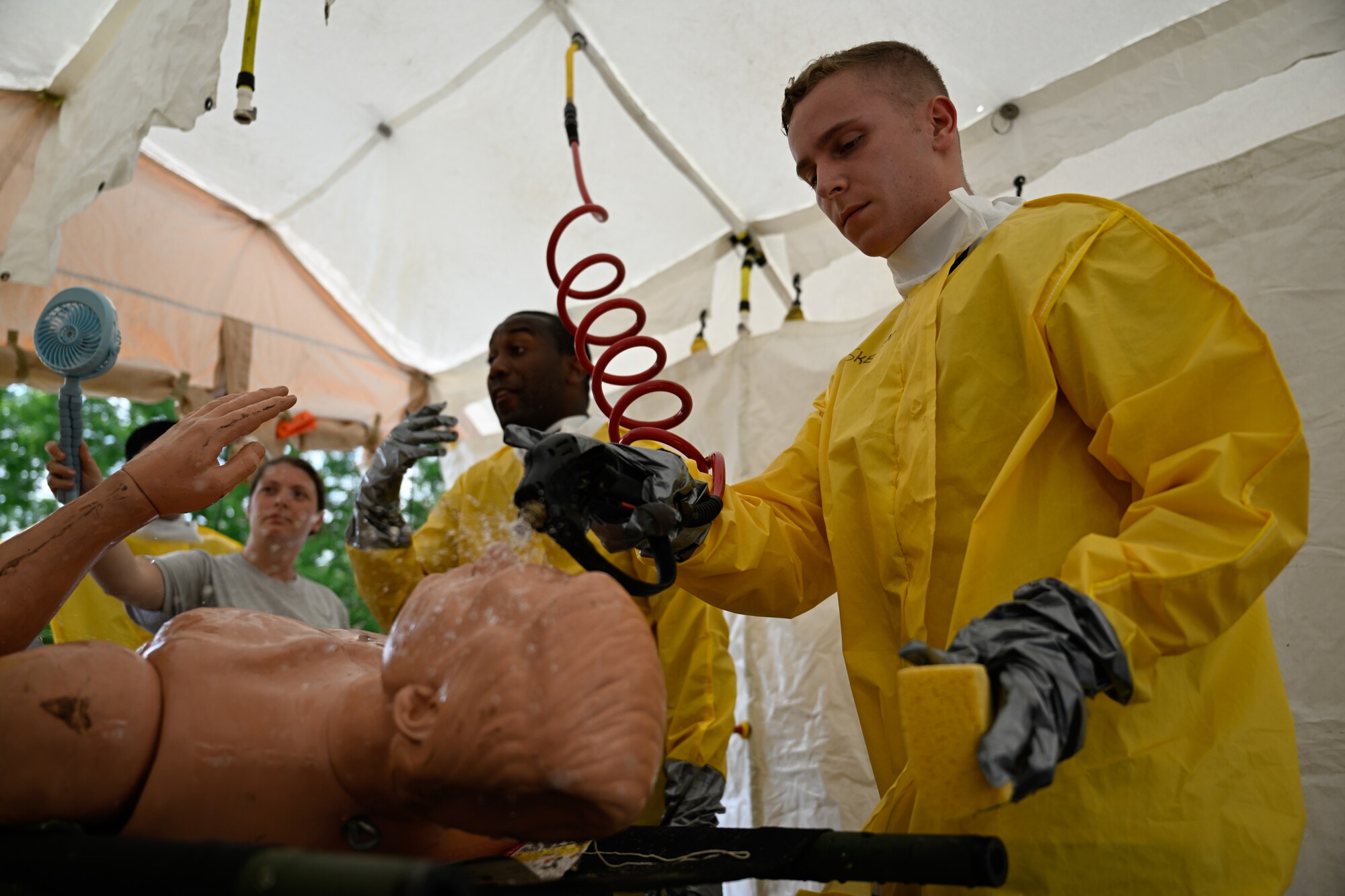Airmen participate in a decontamination exercise.
