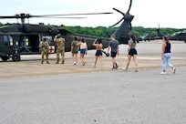 The District of Columbia Army Aviation Command provides spouse orientation flights during family day at Davison Army Airfield, Fort Belvoir, Va., on August 11, 2024. In addition to a capabilities brief presented by the State Aviation Officer and senior leaders, spouses and family members learned more about DCARNG assets to include rotary-wing and fixed-wing operational support airlifts, medical evacuation capabilities, and interagency partnerships.