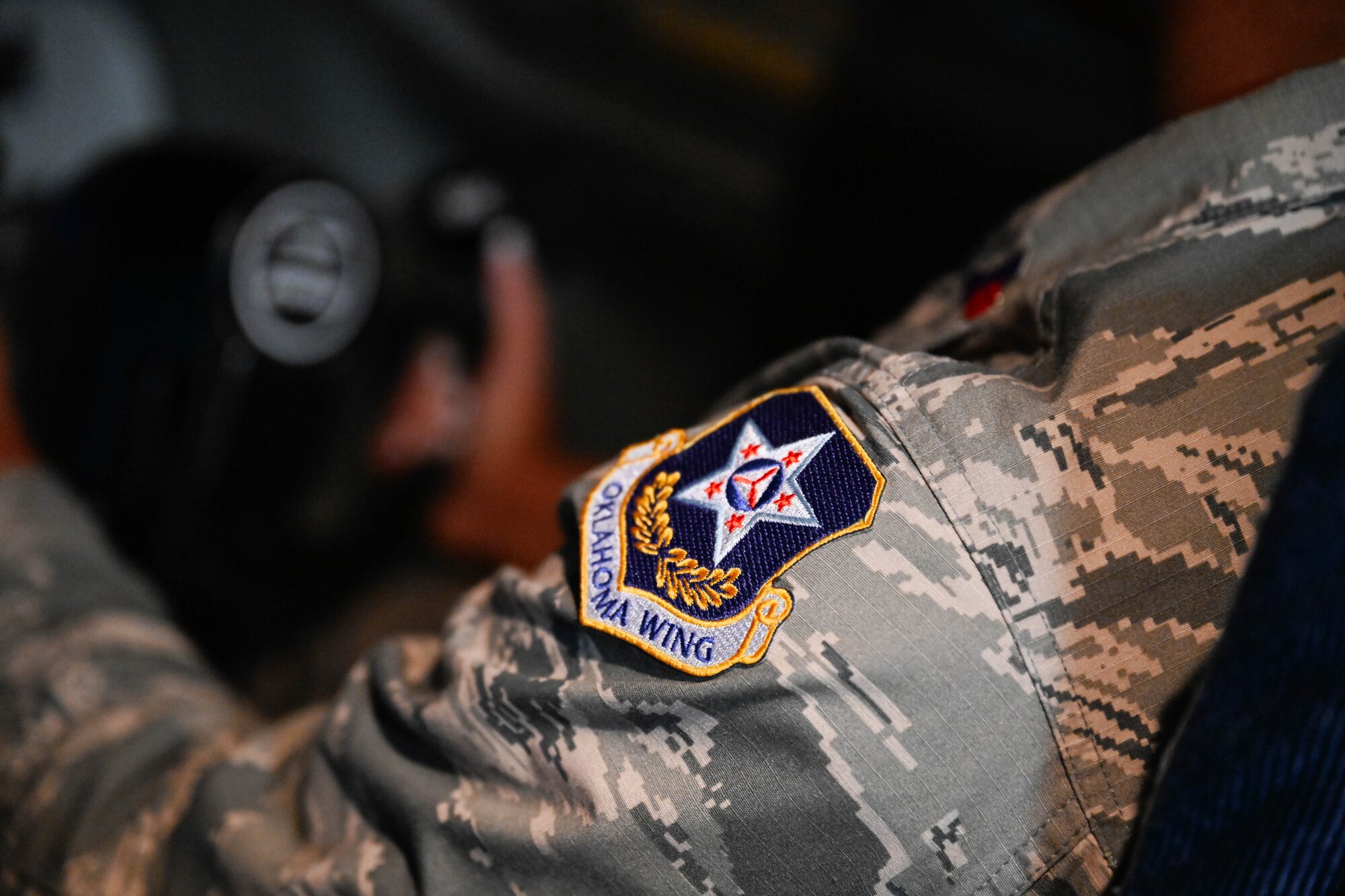 A photo of the Civil Air Patrol (CAP) Oklahoma Wing patch at Altus Air Force Base, Oklahoma, Aug. 12, 2024. CAP’s three major programs are emergency services, aerospace education, and cadet programs. (U.S. Air Force Photo by Airman 1st Class Jonah G. Bliss)