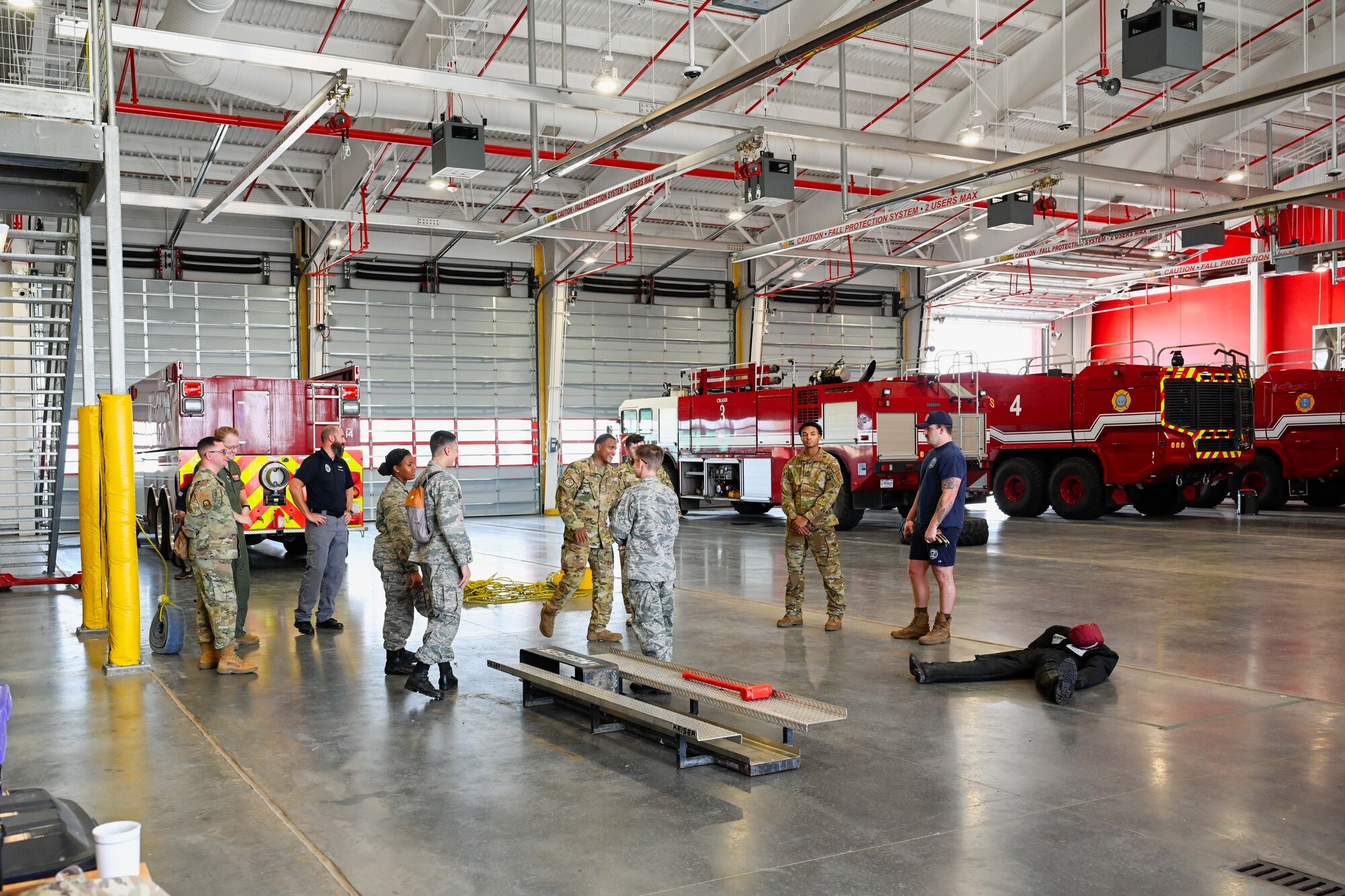 97th Civil Engineer Squadron Airmen showcase the Altus Air Force Base Headquarters Fire Station to Altus Chapter Civil Air Patrol cadets at Altus AFB, Oklahoma, Aug. 12, 2024. The Airmen showed them all around the station, including the dorms, the study rooms, and the gym. (U.S. Air Force photo by Airman 1st Class Jonah Bliss)