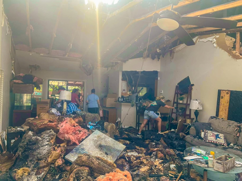 433rd Airlift Wing Reserve Citizen Airmen, along with family members and friends of Master Sgt. Jesse Gonzalez, a 356th Airlift Squadron flight engineer and scheduler, salvage whatever they can after a fire severely damaged the Gonzalez family’s San Antonio, Texas home July 6, 2024.