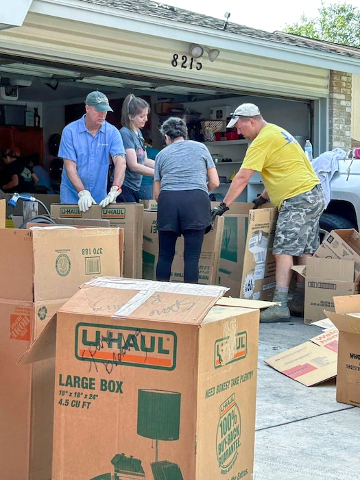 433rd Airlift Wing Reserve Citizen Airmen, along with family members and friends of Master Sgt. Jesse Gonzalez, a 356th Airlift Squadron flight engineer and scheduler, help pack up belongings after a fire severely damaged the Gonzalez family’s San Antonio, Texas home July 6, 2024.