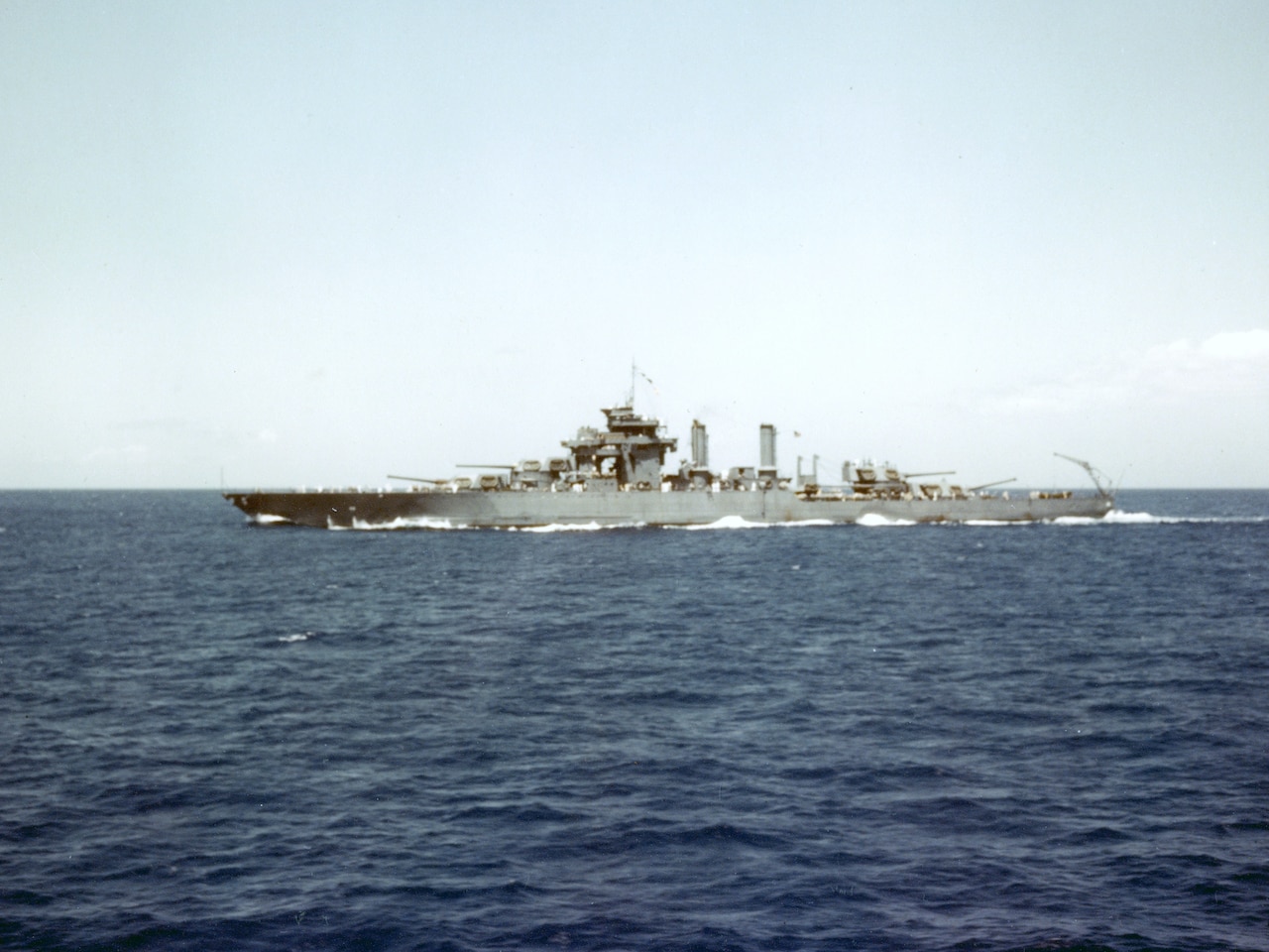 A battleship sails at sea.