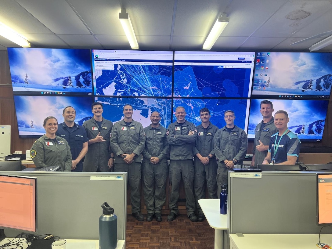 U.S. Coast Guard personnel from District Fourteen and Air Station Barbers Point pose for a photo with a member of the Royal New Zealand Air Force and Forum Fisheries Agency at the Regional Fisheries Surveillance Centre (RFSC) in Honiara, Solomon Islands, Aug. 13, 2024. An HC-130 Hercules airplane crew from Air Station Barbers Point toured the RFSC as part of their participation in Operation Island Chief, during which they searched over 232,100 square miles in the South Pacific to detect any illegal, unreported and unregulated fishing activity. (U.S. Coast Guard courtesy photo)