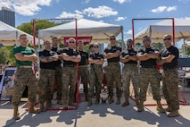 U.S. Marine Corps Lance Cpl. Bruno, the Marine Corps Recruit Depot San Diego and Western Recruiting Region mascot, takes a photo with Marines from Recruiting Station Chicago, Chicago, Illinois, Aug. 10, 2024. Bruno attended the Chicago Air and Water Show in support of community relations and recruiting efforts. The Chicago Air and Water Show presented by the City of Chicago is the largest free show of its kind in the United States. (U.S. Marine Corps photo by Cpl. Alexander O. Devereux)