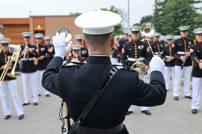 U.S. Marine Corps Chief Warrant Officer 2 Nathan Doggett, center, a native of Illinois and the director of the 2nd Marine Aircraft Wing (MAW) Band, conducts sound checks prior to the opening parade of the Fergus Scottish Festival & Highland Games in Ontario, Canada, Aug. 8, 2024. The Fergus Scottish Festival & Highland Games is an annual three-day event celebrating local Scottish heritage through various forms of entertainment. The 2nd MAW Band will be performing during the festival to strengthen community relationships and reaffirm the history, customs, and traditions represented by the United States Marine Corps. (U.S. Marine Corps photo by Staff. Sgt. Theodore Bergan)