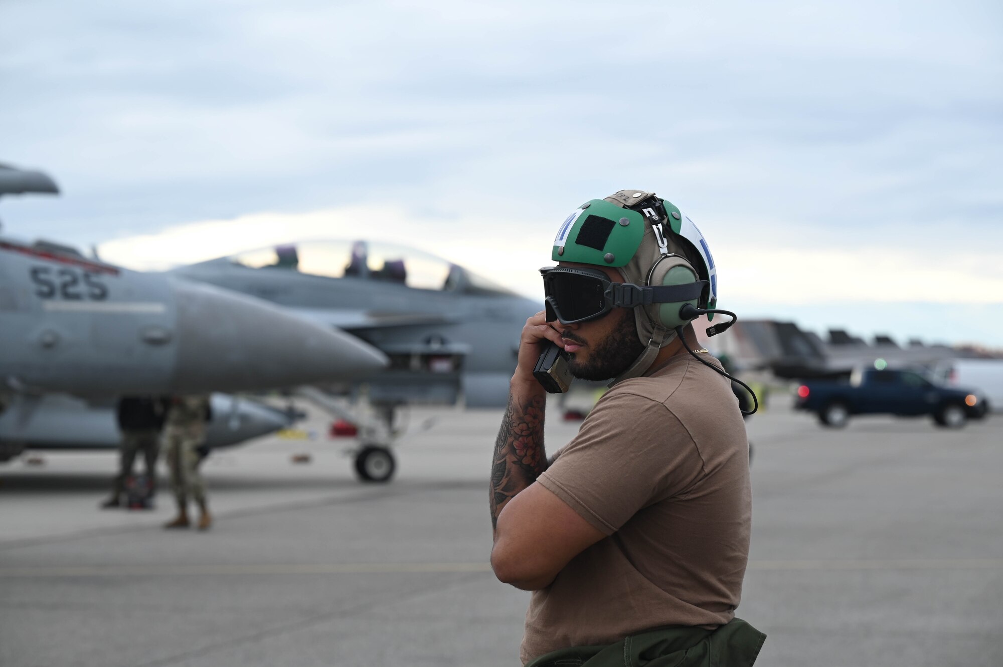 A U.S. Navy Aviation Machinist Mate, assigned to the Electronic Attack Squadron (VAQ-135), speaks on the radio during Red Flag-Alaska 24-3 at Eielson Air Force Base, Alaska, Aug. 19, 2024.