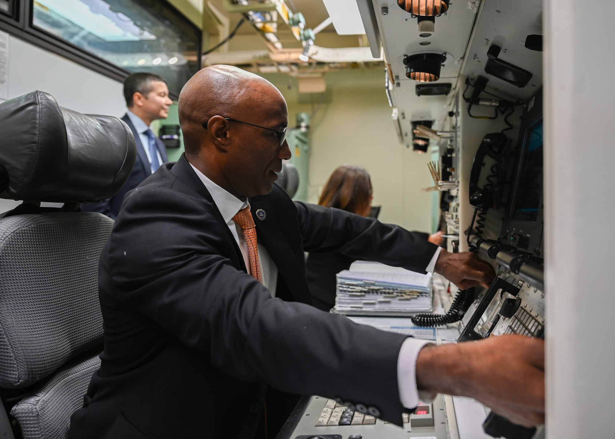 A man turns the keys of an ICBM trainer during a visit to a military base.