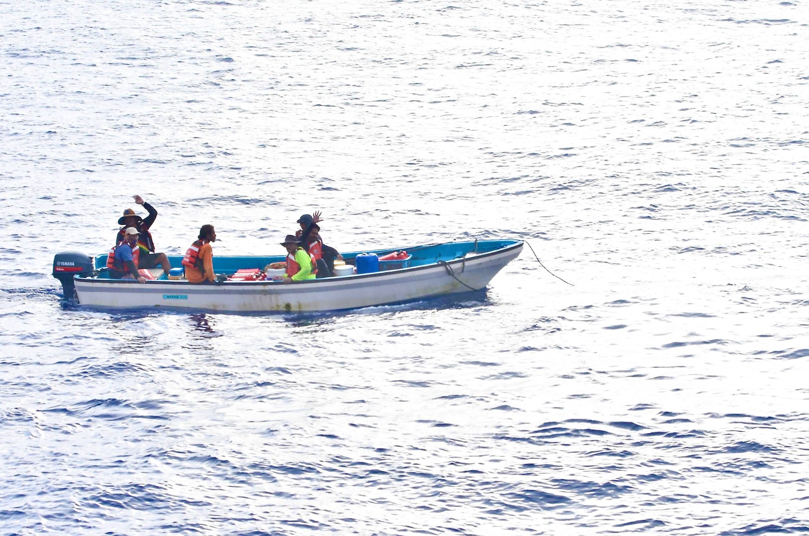 The crew of the USCGC Oliver Henry (WPC 1140) tow a disabled 22-foot fiberglass boat with six fishermen in good condition aboard about 11 nautical miles off Satawal,  Federated States of Micronesia, on Aug. 18, 2024. The vessel, which had been adrift after experiencing engine failure, was towed to Satawal Atoll by the Oliver Henry. The Joint Rescue Sub-Center (JRSC) Guam watch received a distress alert from a 406MHz Personal Locator Beacon (PLB) registered in the United States at approximately 9 a.m. local time on Aug. 17. The beacon, lent out by a Yap-based owner to outer island fishermen, was activated, signaling potential distress about 27 nautical miles north northeast of Satawal. (U.S. Coast Guard photo by Petty Officer 3rd Class Ryder Nollan)