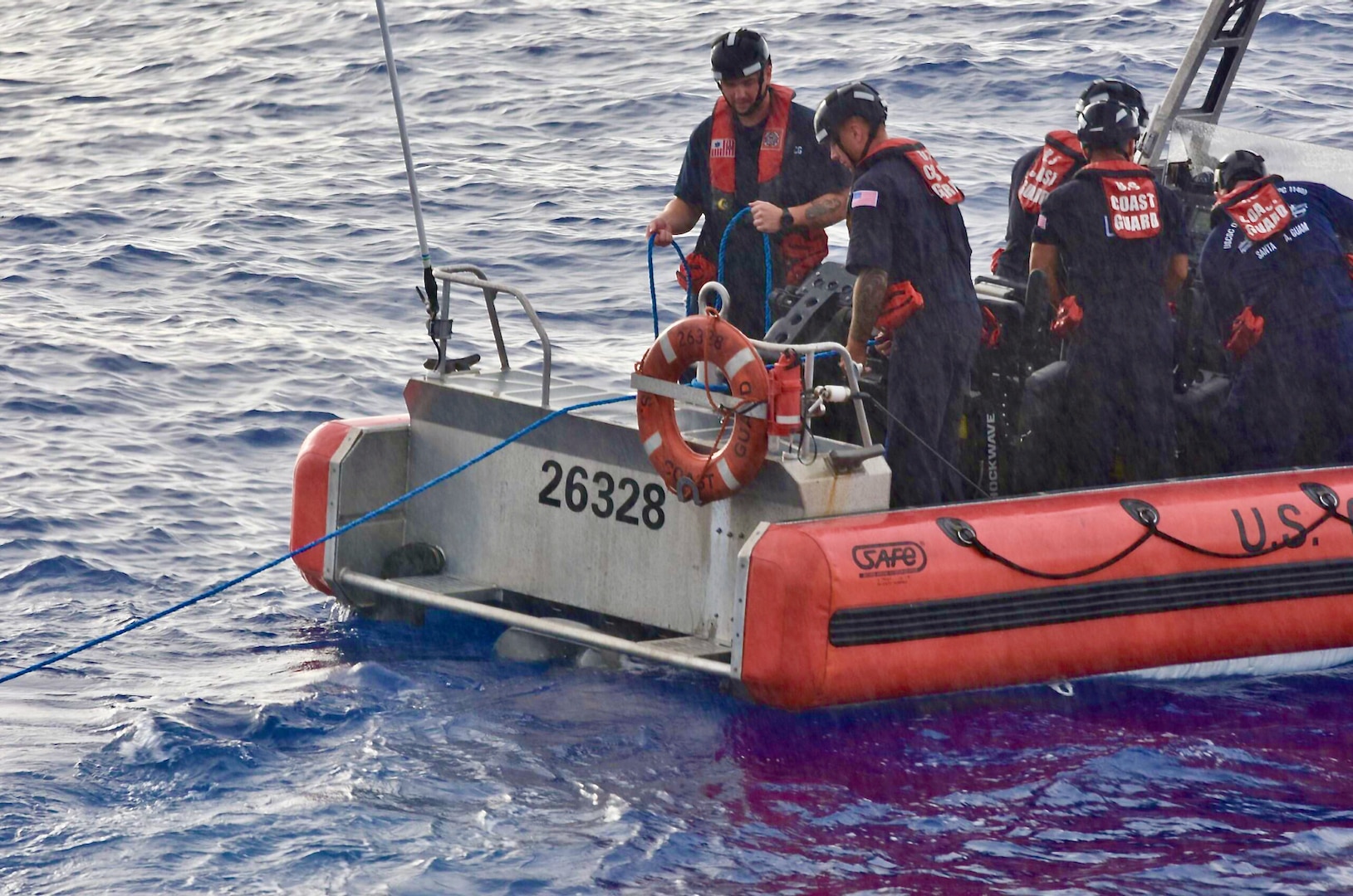 The crew of the USCGC Oliver Henry (WPC 1140) tow a disabled 22-foot fiberglass boat with six fishermen in good condition aboard about 11 nautical miles off Satawal,  Federated States of Micronesia, on Aug. 18, 2024. The vessel, which had been adrift after experiencing engine failure, was towed to Satawal Atoll by the Oliver Henry. The Joint Rescue Sub-Center (JRSC) Guam watch received a distress alert from a 406MHz Personal Locator Beacon (PLB) registered in the United States at approximately 9 a.m. local time on Aug. 17. The beacon, lent out by a Yap-based owner to outer island fishermen, was activated, signaling potential distress about 27 nautical miles north northeast of Satawal. (U.S. Coast Guard photo by Petty Officer 3rd Class Ryder Nollan)