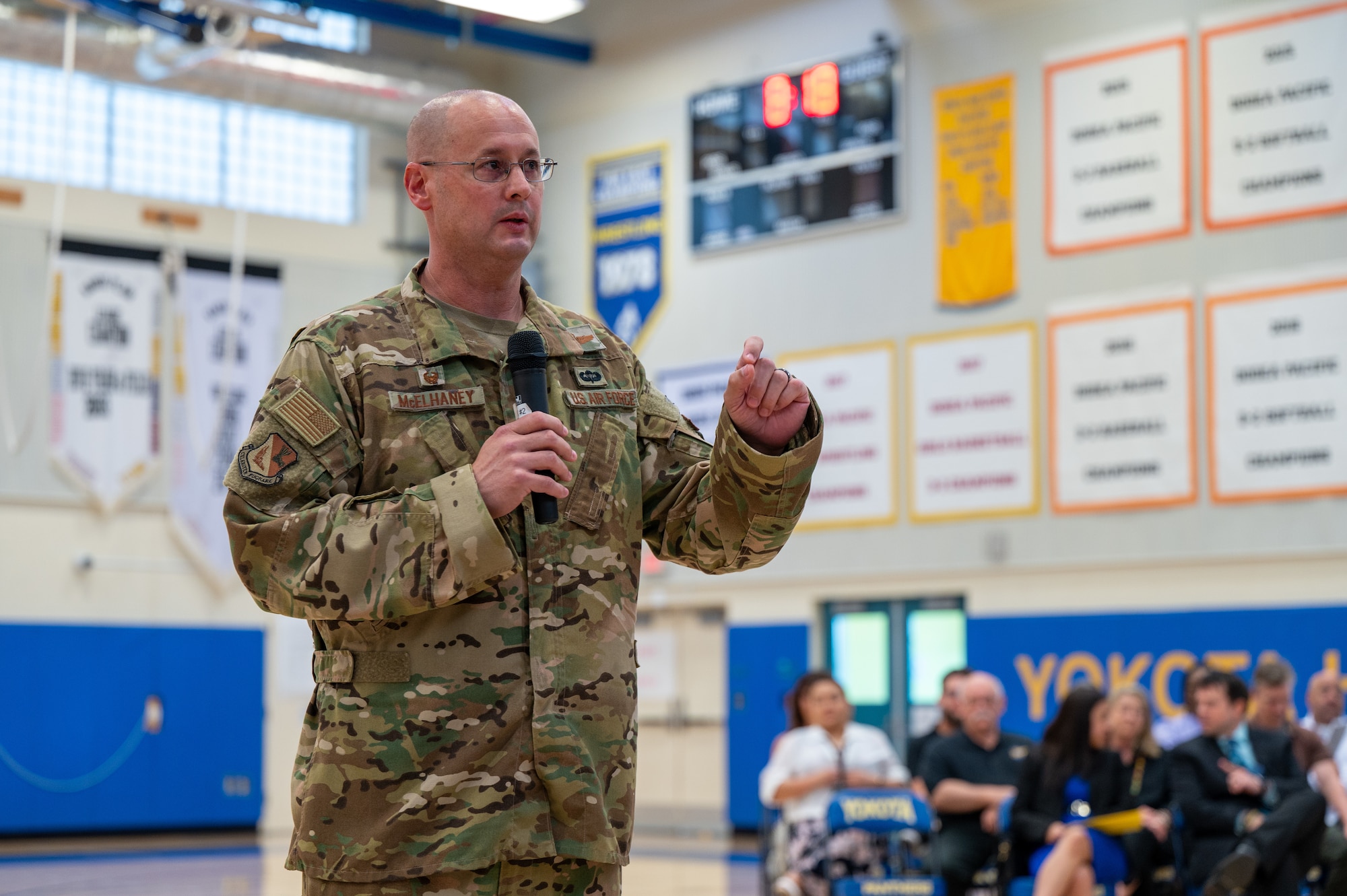 U.S. Air Force Col. Richard McElhaney, 374th Airlift Wing commander, delivers remarks at an assembly to mark the start of the new academic year at Yokota High School on Yokota Air Base, Japan.