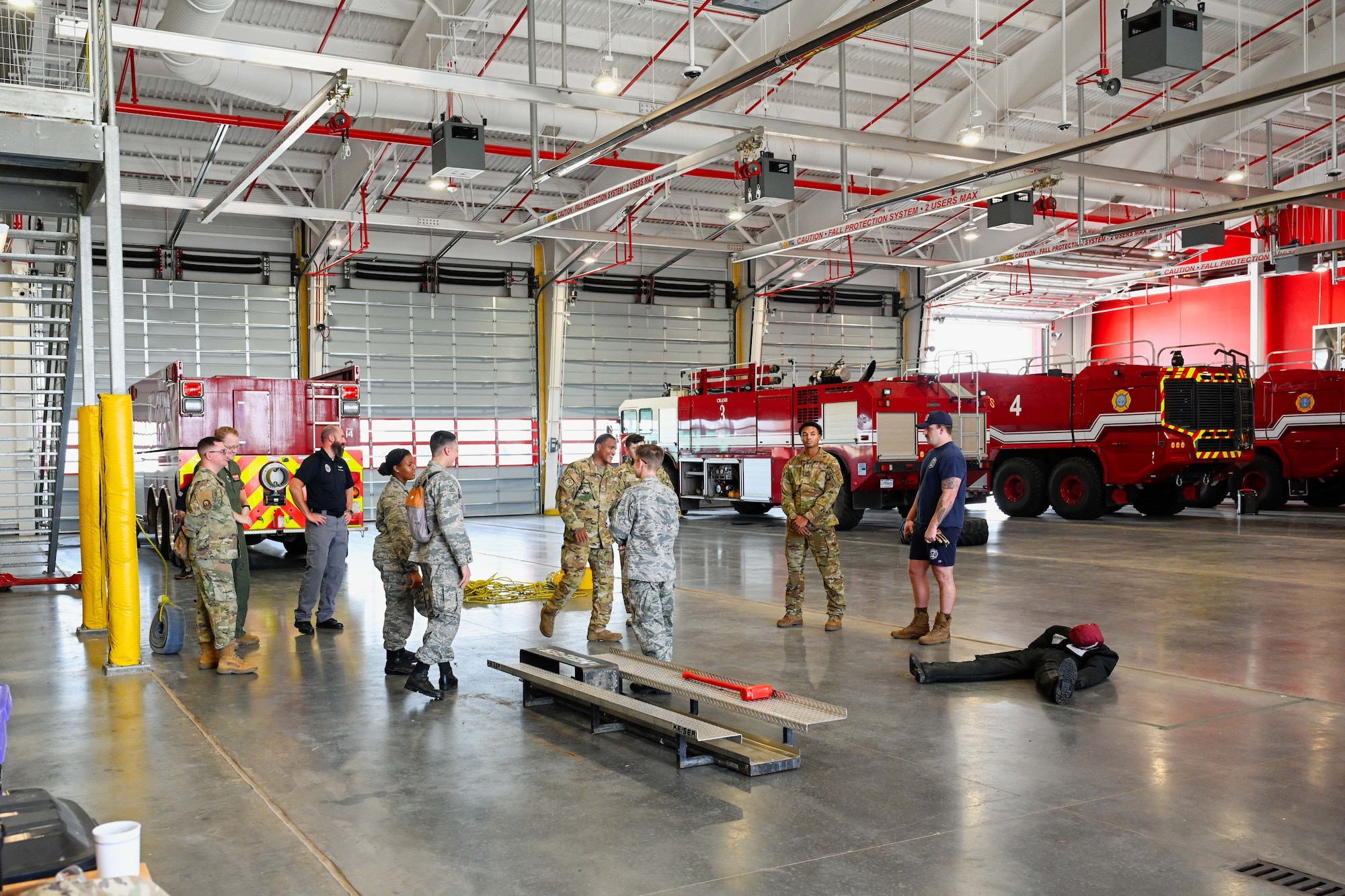 97th Civil Engineer Squadron Airmen showcase the Altus Air Force Base Headquarters Fire Station to Altus Chapter Civil Air Patrol cadets at Altus AFB, Oklahoma, Aug. 12, 2024. The Airmen showed them all around the station, including the dorms, the study rooms, and the gym. (U.S. Air Force photo by Airman 1st Class Jonah Bliss)