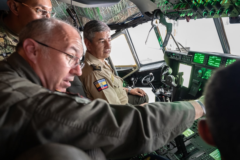 U.S. Air Force Lt. Col. Randall Hood, left, deputy commander of the 165th Airlift Squadron, discusses the airlift capabilities of the C-130J Super Hercules aircraft with Ecuadorian military and civilian emergency management officials during a tour of the Kentucky Air National Guard Base in Louisville, Ky., Aug. 6, 2024. The Ecuadorians were visiting as part of the State Partnership Program to learn more about the Kentucky Guard’s emergency response capabilities and interagency cooperation across the state. (U.S. Air National Guard photo by Dale Greer)