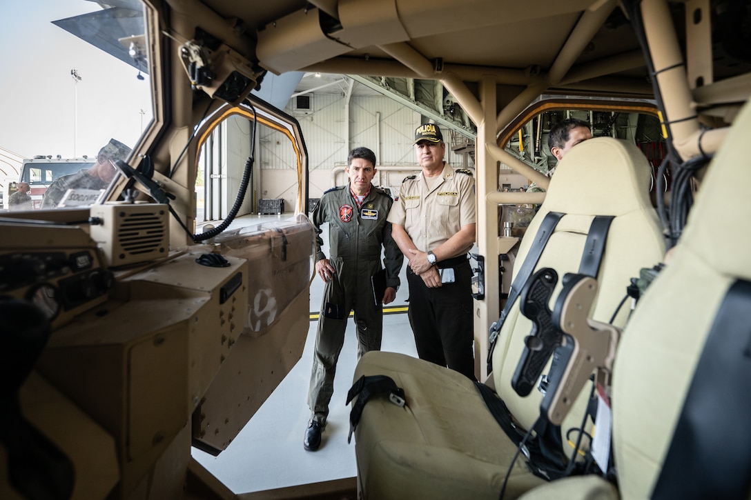 Ecuadorian military and civilian emergency management officials inspect a tactical vehicle at the Kentucky Air National Guard Base in Louisville, Ky., Aug. 6, 2024. The Ecuadorians were visiting as part of the State Partnership Program to learn more about the Kentucky Guard’s emergency response capabilities and interagency cooperation across the state. (U.S. Air National Guard photo by Dale Greer)