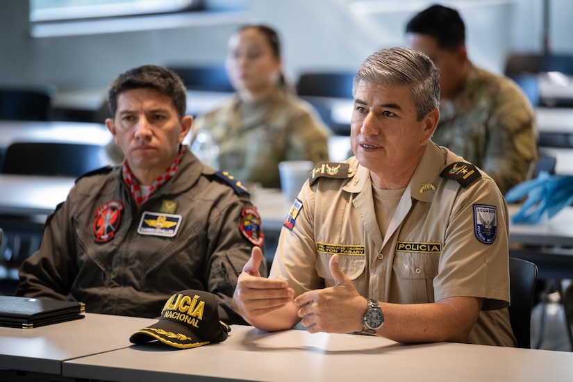 Col. Milton Fabary Montalvo Calderon, commander of the Manabi Police Subzone of the Ecuador National Police, talks to Airmen from the 123rd Airlift Wing during an information exchange for the State Partnership Program at the Kentucky Air National Guard Base in Louisville, Ky., Aug. 9, 2024. Calderon was one of six Ecuadorian military and civilian emergency management officials who spent a week touring Kentucky National Guard facilities and civilian emergency response agencies to learn more about the Kentucky Guard’s capabilities and interagency cooperation across the state. (U.S. Air National Guard photo by Dale Greer)