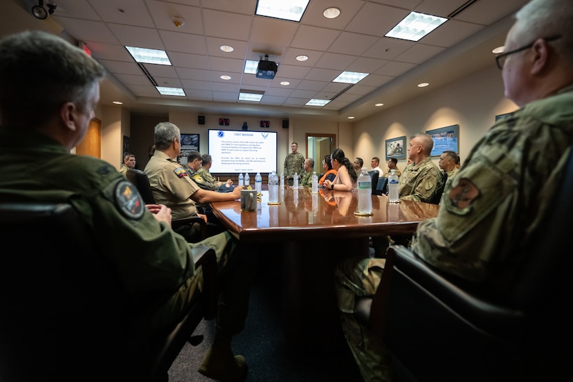 Ecuadorian military and civilian emergency management officials receive a mission briefing at the Kentucky Air National Guard Base in Louisville, Ky., Aug. 6, 2024. The Ecuadorians were visiting as part of the State Partnership Program to learn more about the Kentucky Guard’s emergency response capabilities and interagency cooperation across the state. (U.S. Air National Guard photo by Dale Greer)