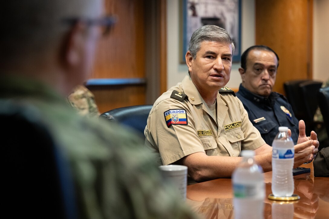 Col. Milton Fabary Montalvo Calderon, commander of the Manabi Police Subzone of the Ecuador National Police, talks to Airmen from the 123rd Airlift Wing during an information exchange for the State Partnership Program at the Kentucky Air National Guard Base in Louisville, Ky., Aug. 6, 2024. Calderon was one of six Ecuadorian military and civilian emergency management officials who spent a week touring Kentucky National Guard facilities and civilian emergency response agencies to learn more about the Kentucky Guard’s capabilities and interagency cooperation across the state. (U.S. Air National Guard photo by Dale Greer)