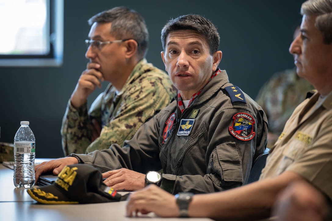 Ecuadorian Air Force Lt. Col. Darwin Manuel Cevallos Tapia, commander of the 221st Flight Group and 22nd Fighter Wing, talks to Airmen from the 123rd Airlift Wing during an information exchange for the State Partnership Program at the Kentucky Air National Guard Base in Louisville, Ky., Aug. 9, 2024. Tapia was one of six Ecuadorian military and civilian emergency management officials who spent a week touring Kentucky National Guard facilities and civilian emergency response agencies to learn more about the Kentucky Guard’s capabilities and interagency cooperation across the state. (U.S. Air National Guard photo by Dale Greer)