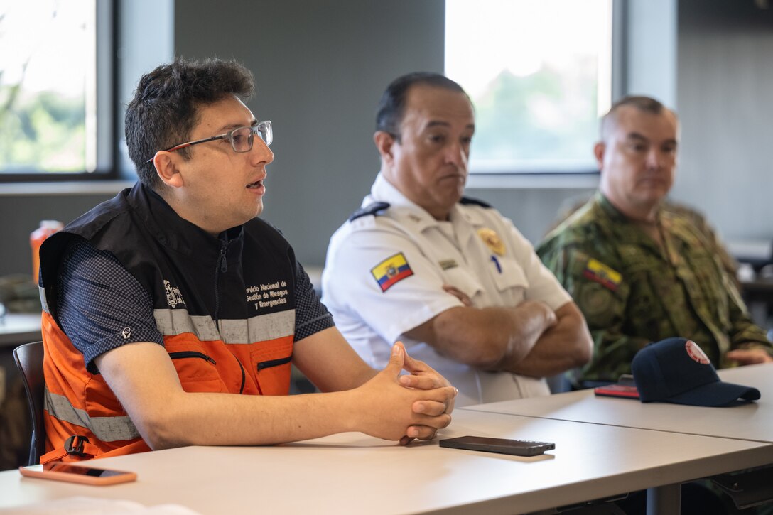 Emerson Daniel Benitez Saavedra, director of humanitarian assistance for the government of Ecuador, speaks with Airmen from the 123rd Airlift Wing during an information exchange for the State Partnership Program at the Kentucky Air National Guard Base in Louisville, Ky., Aug. 9, 2024. Saavedra was one of six Ecuadorian military and civilian emergency management officials who spent a week touring Kentucky National Guard facilities and civilian emergency response agencies to learn more about the Kentucky Guard’s capabilities and interagency cooperation across the state. (U.S. Air National Guard photo by Dale Greer)