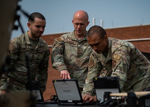 U.S. Air Force members conduct training on a deployable communications suite.