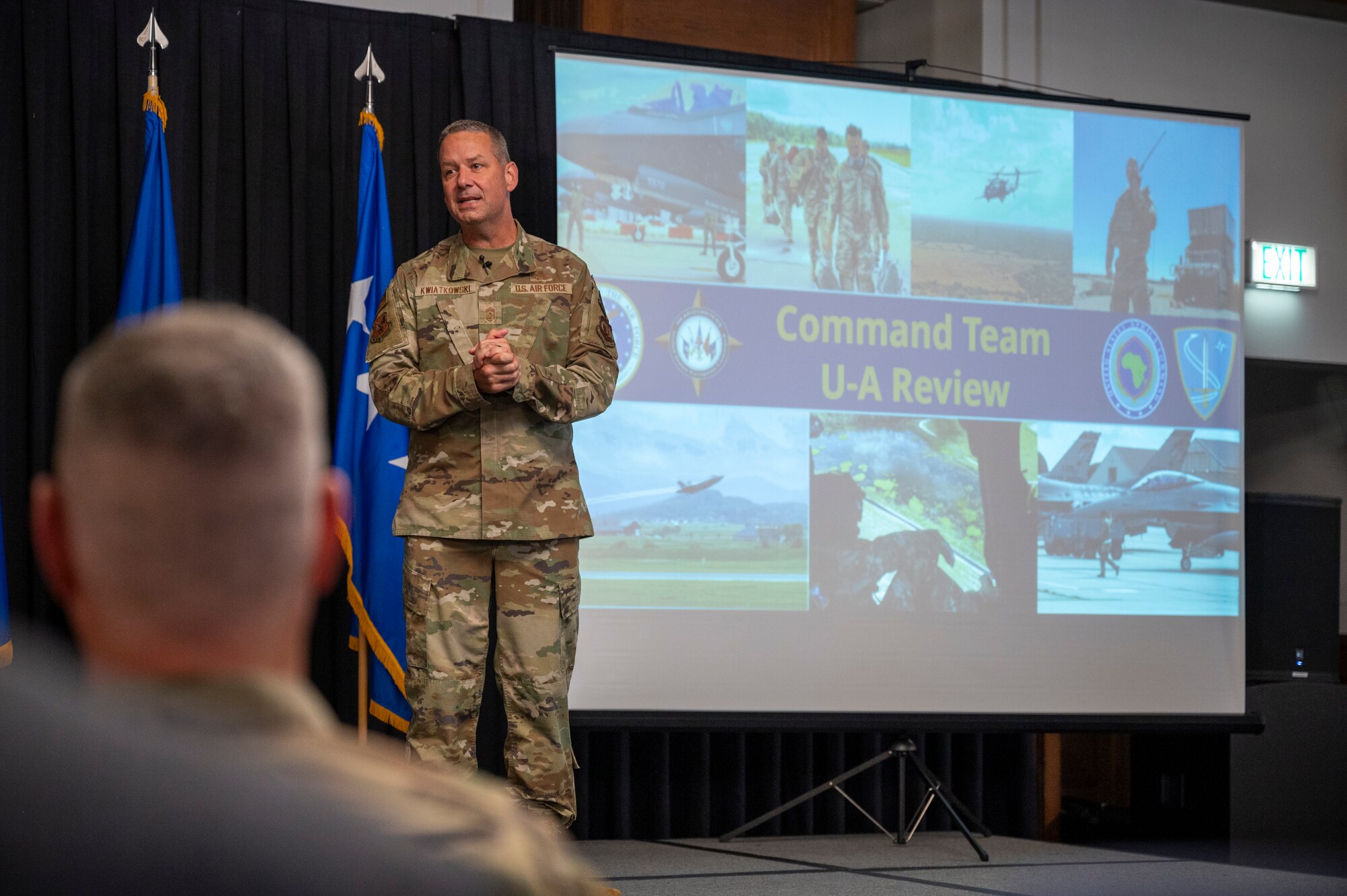 Chief Master Sgt. Randy Kwiatkowski, U.S. Air Forces in Europe - Air Forces Africa command chief, speaks with Airmen during an all-call at Ramstein Air Base, Germany, Aug. 19, 2024.
