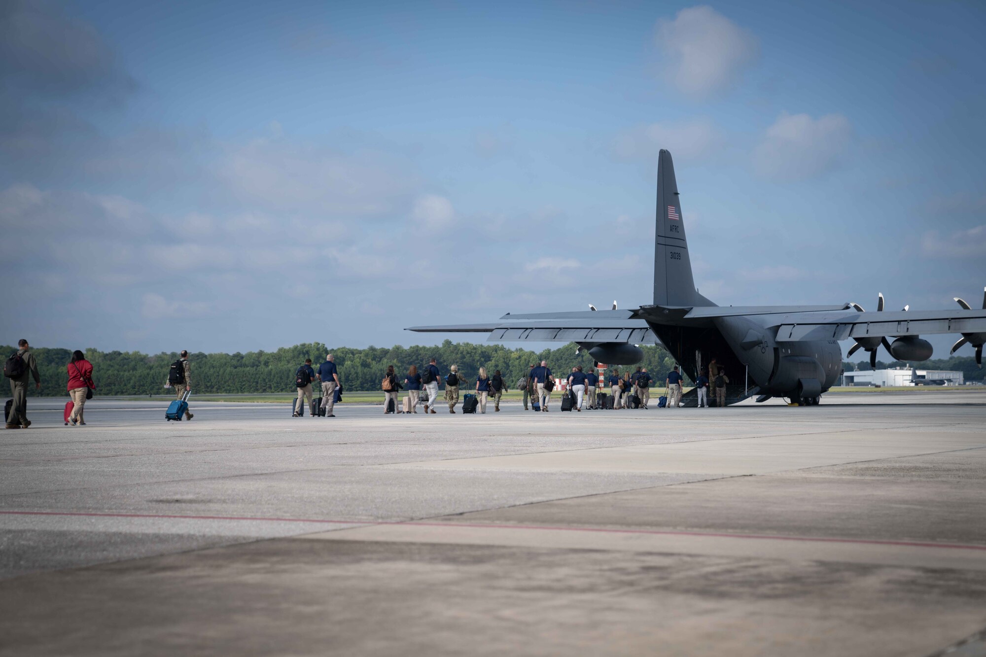 Civic leaders board a C-130H Hercules aircraft at Dobbins Air Reserve Base.
