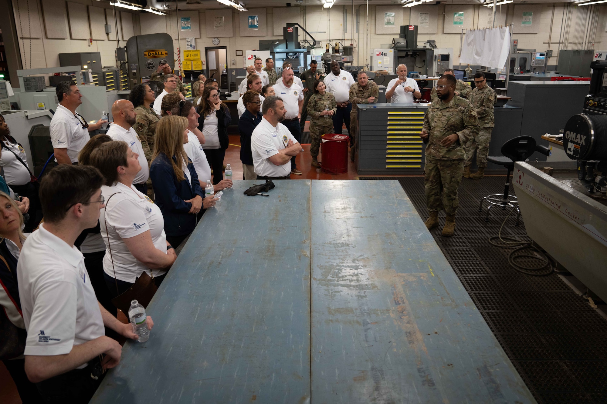 Airmen of the 315th Maintenance Squadron give a give a tour of their metal fabrications shop to civic leaders.