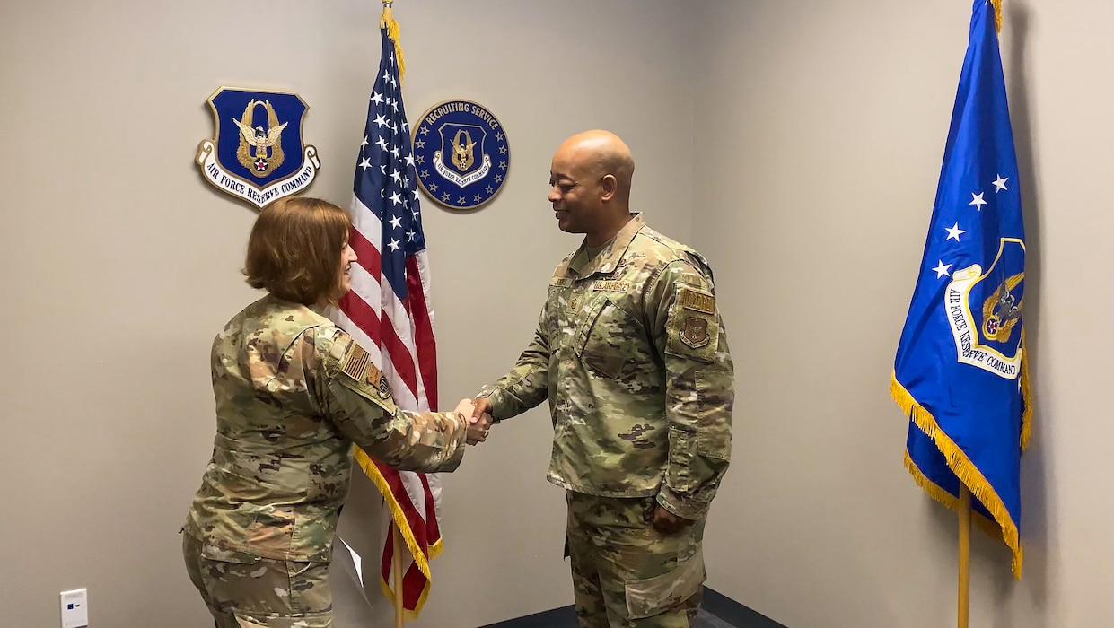 1st Lt. Frankie Jenkins Jr., 433rd Medical Squadron licensed clinical social worker, reaffirms his commitment to service and shakes hands with Col. Jeannie Bisesi, 433rd Mission Support Group commander, after he took the oath of office during an Air Force officer swearing in ceremony at the 433rd Airlift Wing on Jul. 29, 2024.