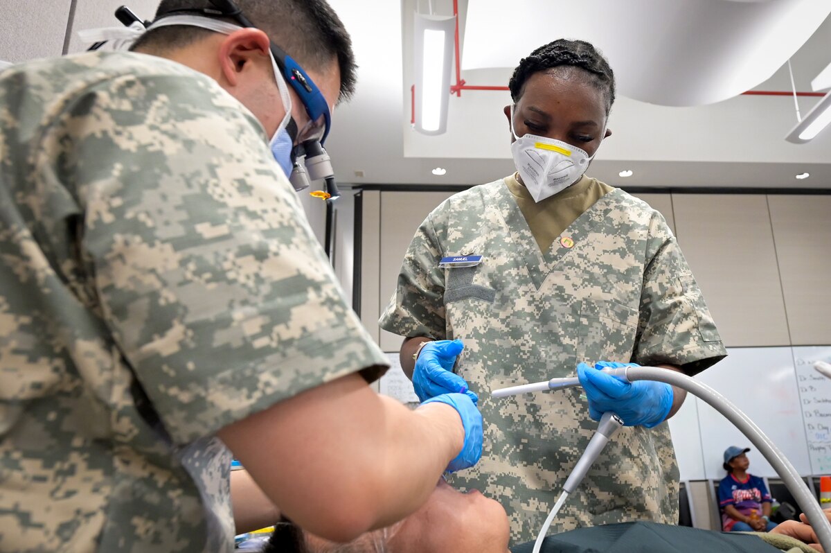 Image of Airmen supporting civilians.