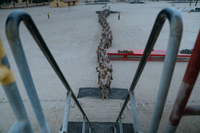 U.S. Marines with Golf Company, 2nd Recruit Training Battalion, line up to climb the rappel tower at Marine Corps Recruit Depot San Diego, California, Aug. 16, 2024. The rappel tower provides opportunities for the new Marines to gain confidence in themselves and their gear, and is one of the last training events Marines will conduct while aboard MCRD San Diego. (U.S. Marine Corps photo by Lance Cpl. Francisco Angel)