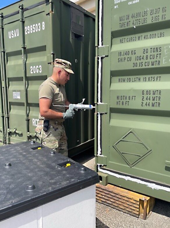 Sgt. Jose Mercado applies a layer of sealant to a storage container during care of supplies in storage (COSIS) operation training at an Army Prepositioned Stocks site in Japan, known as APS-4J. Mercado is part of the 308th Medical Logistics Company, a reserve unit out of Utah, that took part in Operation Patriot Press. OPP is an annual training exercise under Army Materiel Command focusing on sustainment operations.