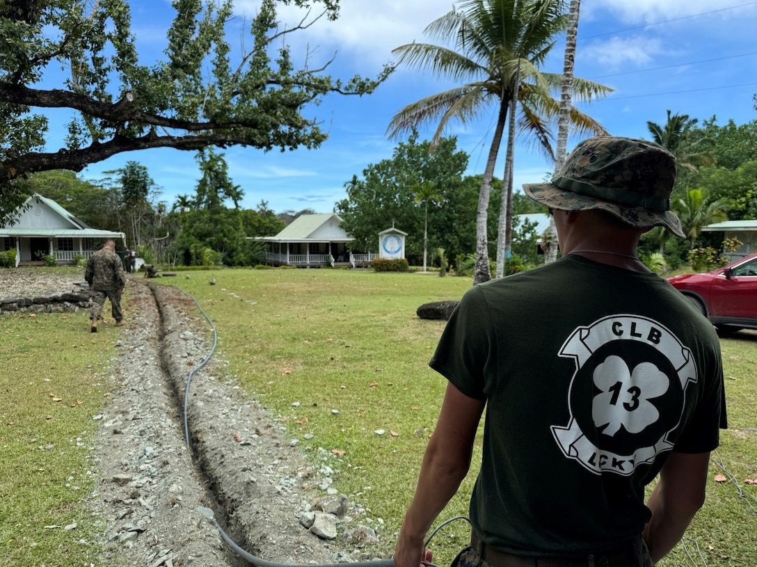 U.S. Marine, Cpl. Aden Thomas, a food service specialist with Combat Logistics Battalion 13, Combat Logistics Regiment 17, 1st Marine Logistics Group, helps feed a protective conduit during a network extension investment project for Yap Catholic High School as part of exercise Koa Moana 24 in Yap, Federated States of Micronesia, Aug. 12 - 13, 2024.