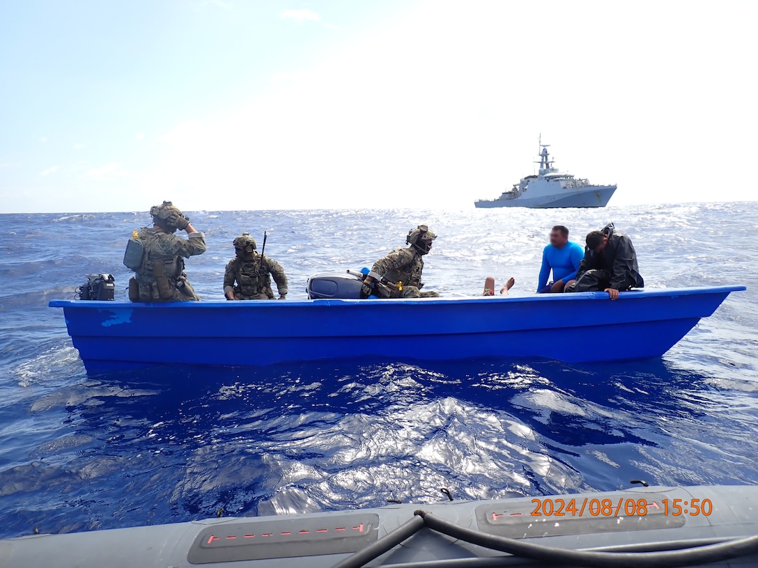 A Coast Guard law enforcement detachment crew detains suspected smugglers on a vessel in the Caribbean Sea, Aug. 8, 2024. This interdiction resulted in a drug offload worth more than $14 million. (Photo by HMS Trent crew)