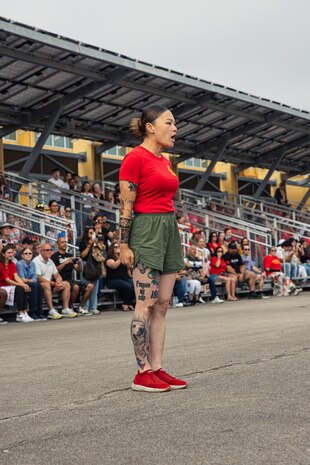 U.S. Marines Corps Gunnery Sgt. Phuong Tsan, chief drill instructor with Alpha Company, 1st Recruit Training Battalion, calls lead series to attention before their motivational run at Marine Corps Recruit Depot San Diego, California, Aug. 15, 2024. The company motivational run is a three-mile cadence run conducted around the Depot and is the last physical training event the Marines will conduct before they graduate from MCRD San Diego. The event is also the first-time friends and families will see their newly transformed Marines. (U.S Marine Corps Cpl. Sarah M. Grawcock)