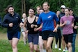 Montana Army National Guard 1st Lt. Chiara Warner runs with high school cross country athletes at Eagle River High School, Aug. 15, 2024. Warner is part of the All Guard Marathon Team and is competing alongside approximately 20 of her peers on the team in Anchorage Runfest, Aug. 17 and 18. The team is comprised of runners from across the country who compete nationally. They bring awareness to the many opportunities the National Guard can offer to enhance recruiting efforts wherever they compete. (Alaska National Guard photo by Staff Sgt. Seth LaCount)